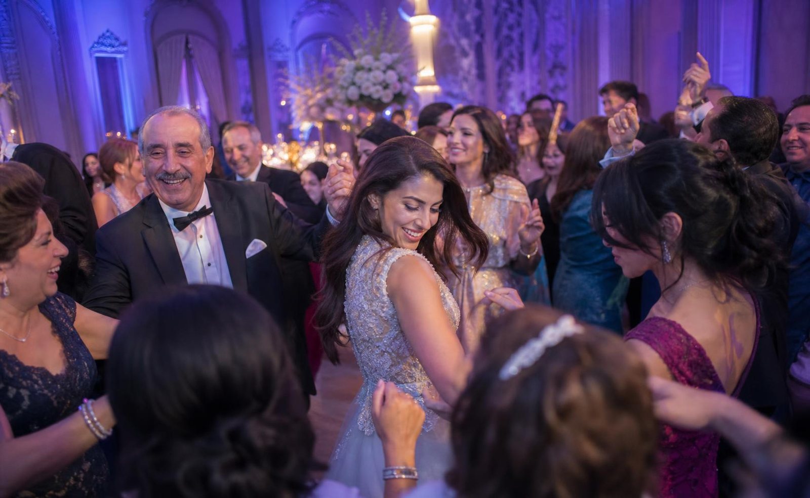 Families and friends of every generation celebrating together at an Arabic wedding in Halifax
